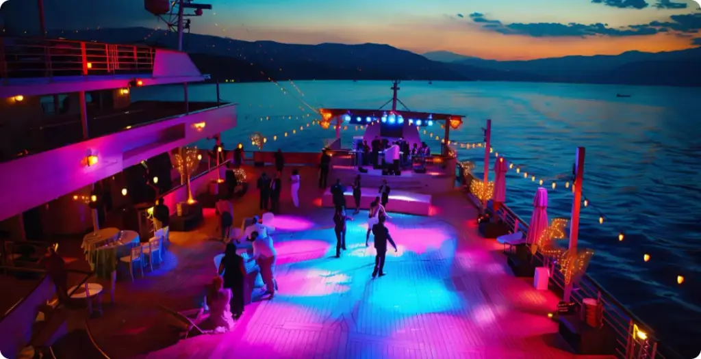 Guests dancing on a yacht deck at dusk, a private event setting for Sway Chicago live band